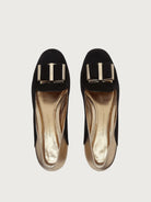Black suede ballet flat by Salvatore Ferragamo, top view with bow hardware