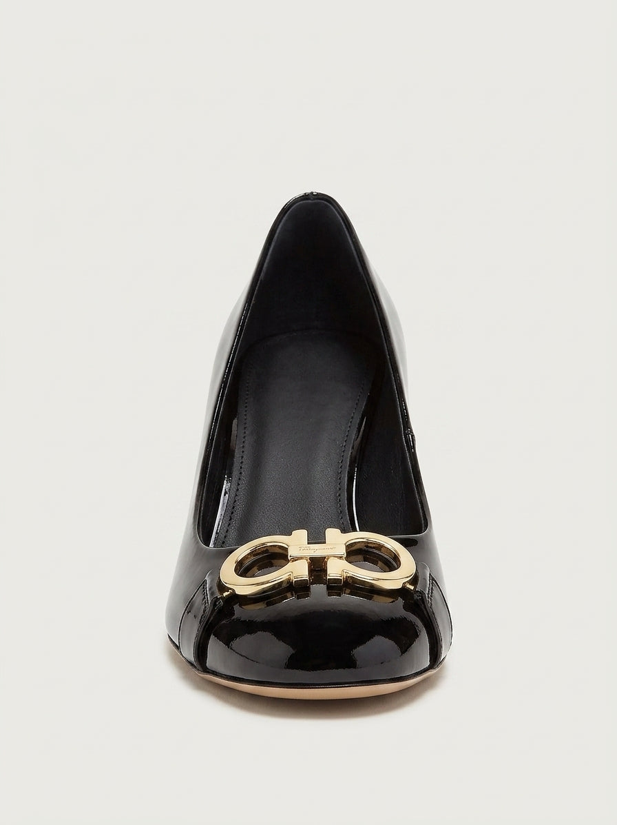 Black patent leather Garda pump with gold-tone Gancini ornament by Salvatore Ferragamo, side view