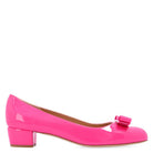 Dark pink Vara bow pump by Salvatore Ferragamo, close-up of metal logo plate