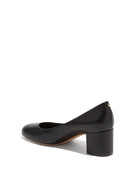 Salvatore Ferragamo Medolla pump in black leather, rear view showing fluted gold-tone heel