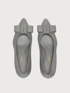 Light grey pointed-toe pump with block heel by Salvatore Ferragamo, rear view