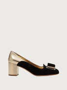 Black suede Salvatore Ferragamo pump with gold heel and toe cap, side view