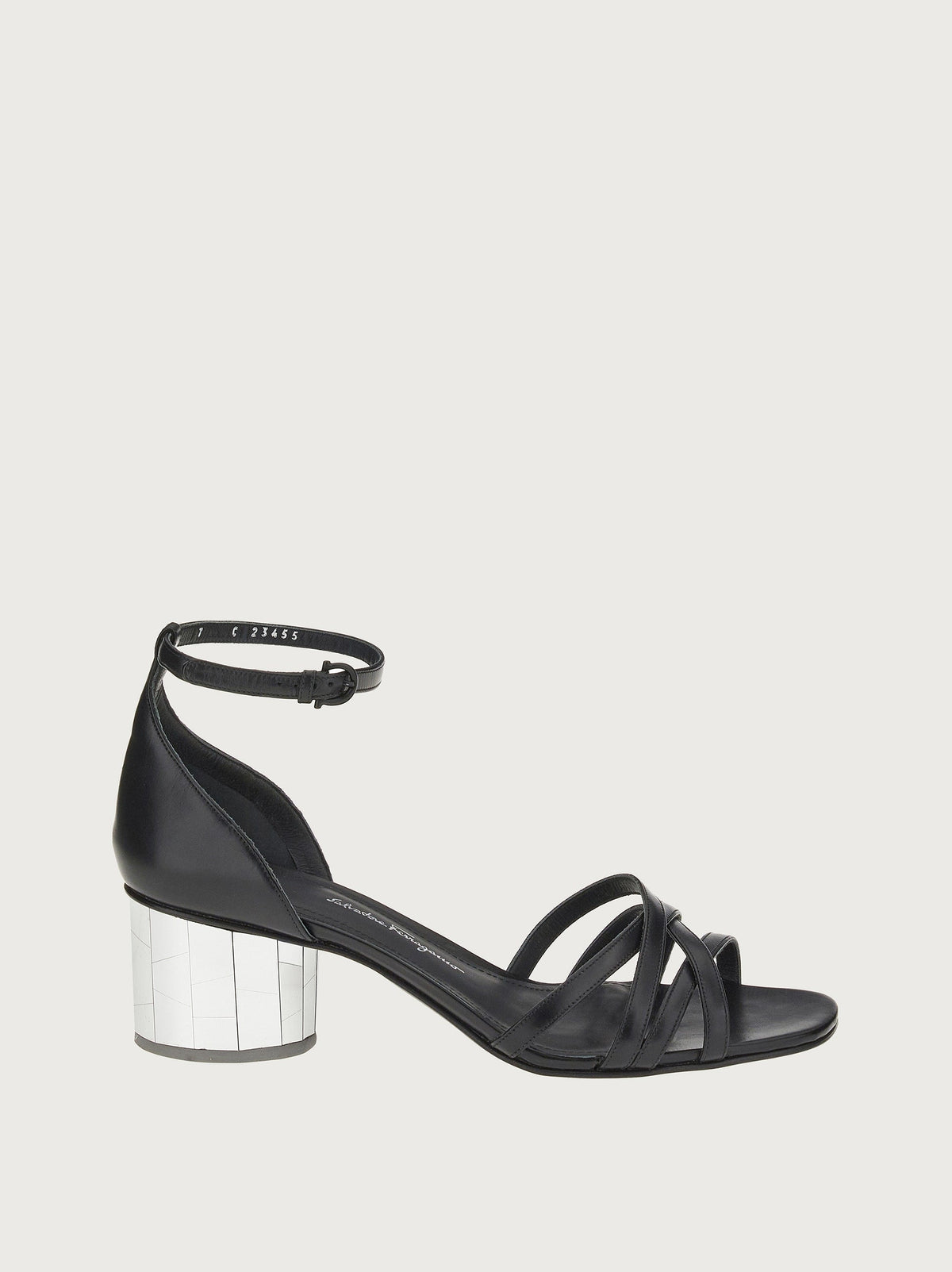 Black leather open-toe sandals with crossed straps, front view by Salvatore Ferragamo