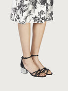 Black leather sandals showing block heel detail by Salvatore Ferragamo
