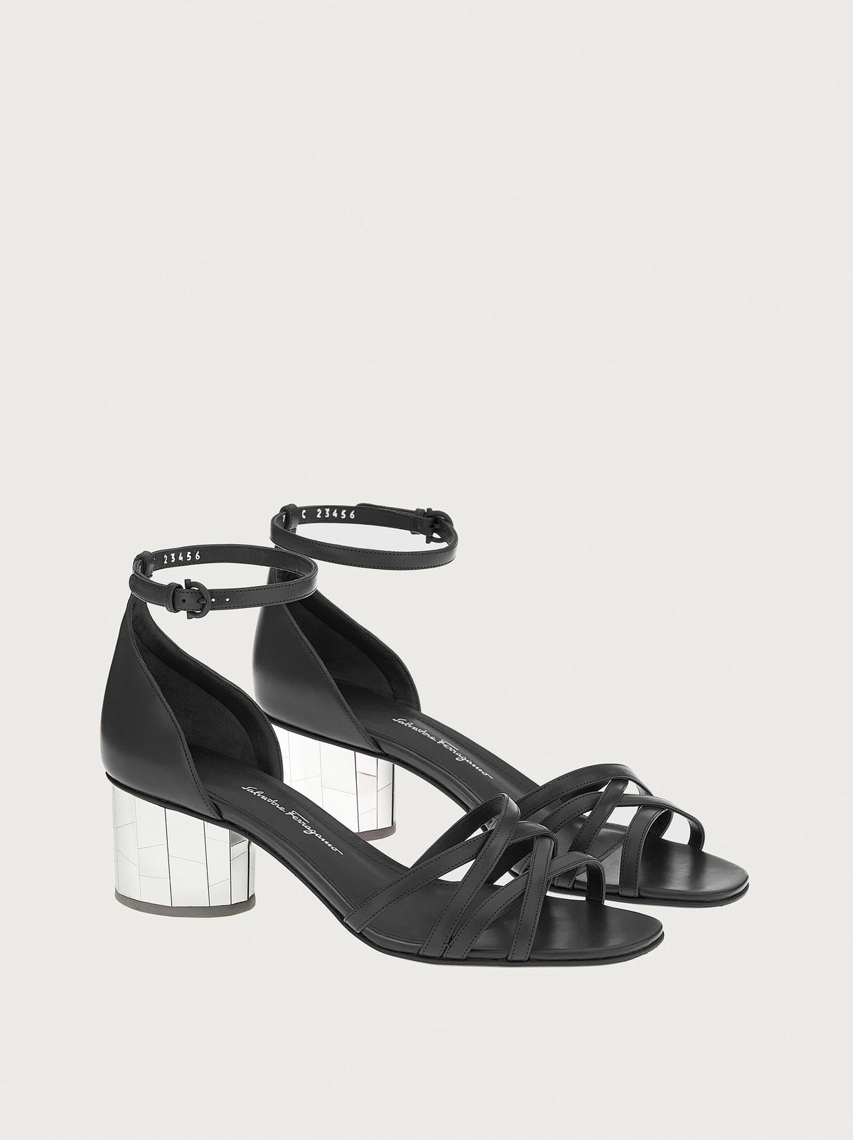 Black leather sandals with crossed strap detailing, top view by Salvatore Ferragamo