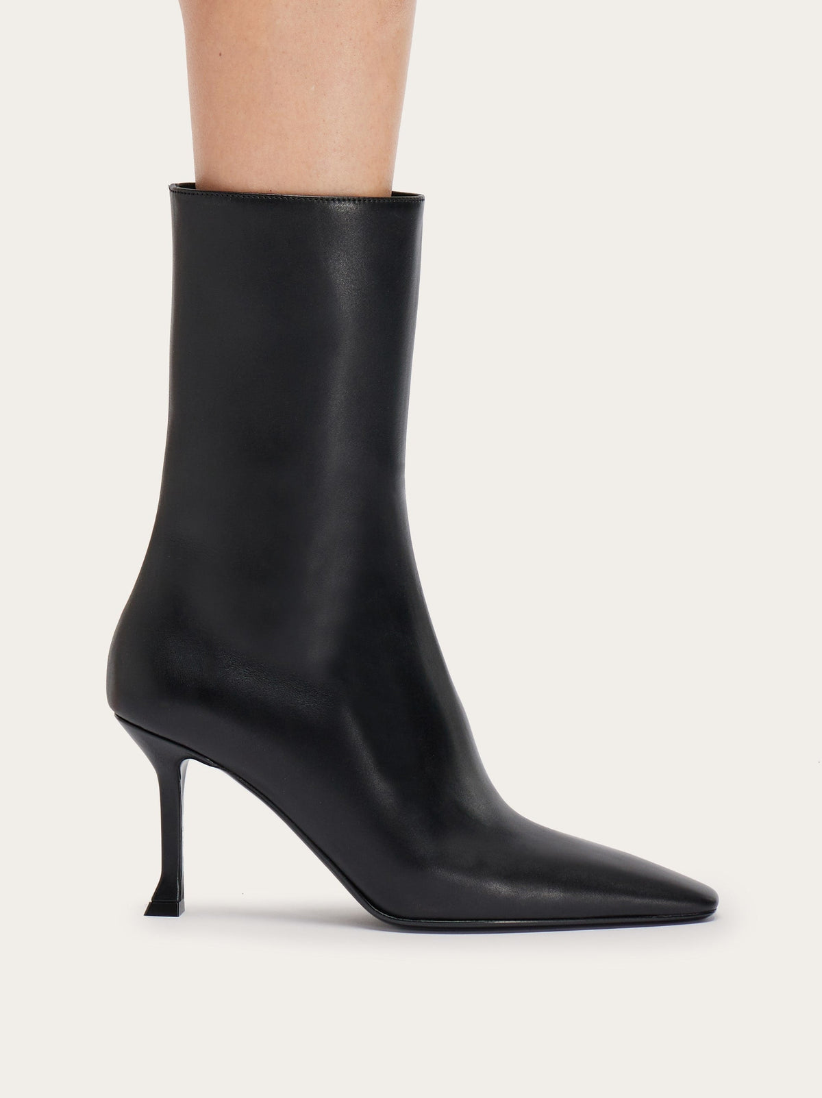 Black Salvatore Ferragamo Selema Z bootie with pointed toe, front angle