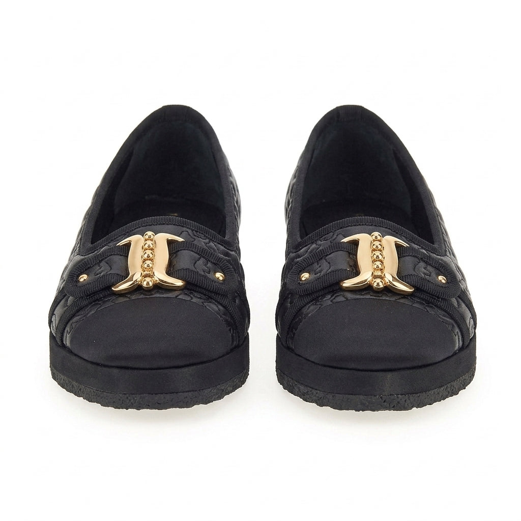 Black quilted Salvatore Ferragamo Kacy P Gal ballet flat with gold buckles, side view