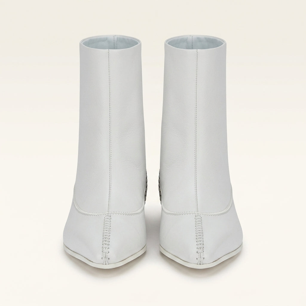 White Salvatore Ferragamo leather bootie with curved toe seam, side view