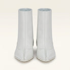 White Salvatore Ferragamo leather bootie with curved toe seam, side view