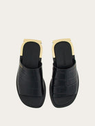 Black Salvatore Ferragamo slide sandals with gold Gancio detail, top view