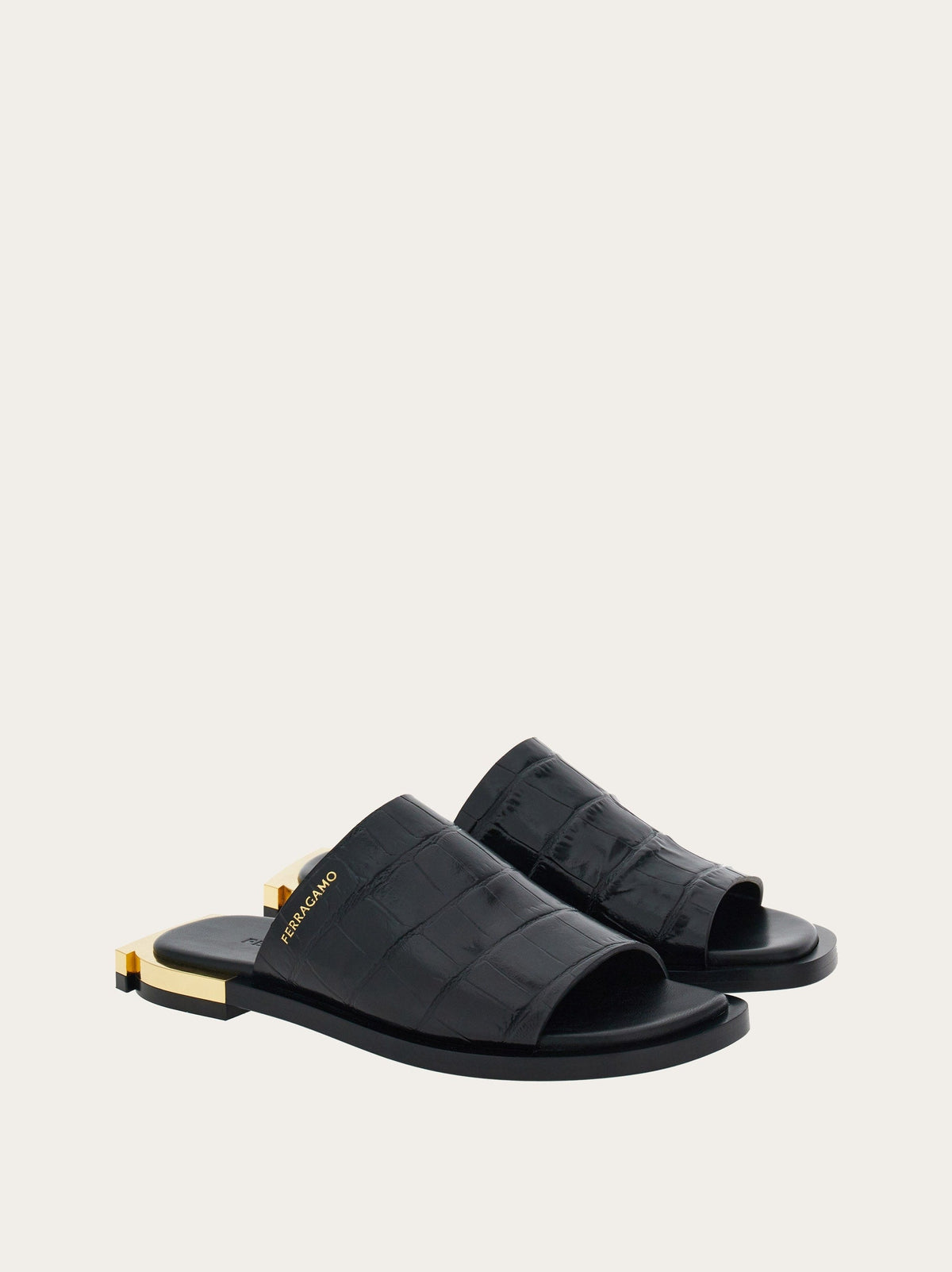 Black Ferragamo Gancini slides showing padded insole, interior view