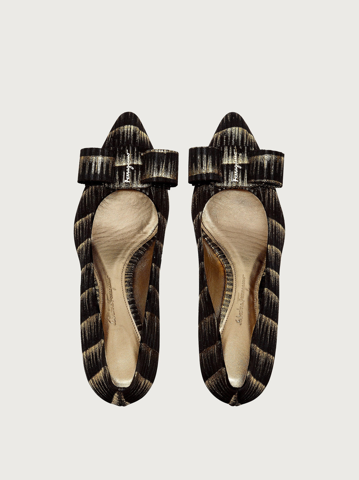 Black and gold jacquard pump by Salvatore Ferragamo, top view showing bow detail