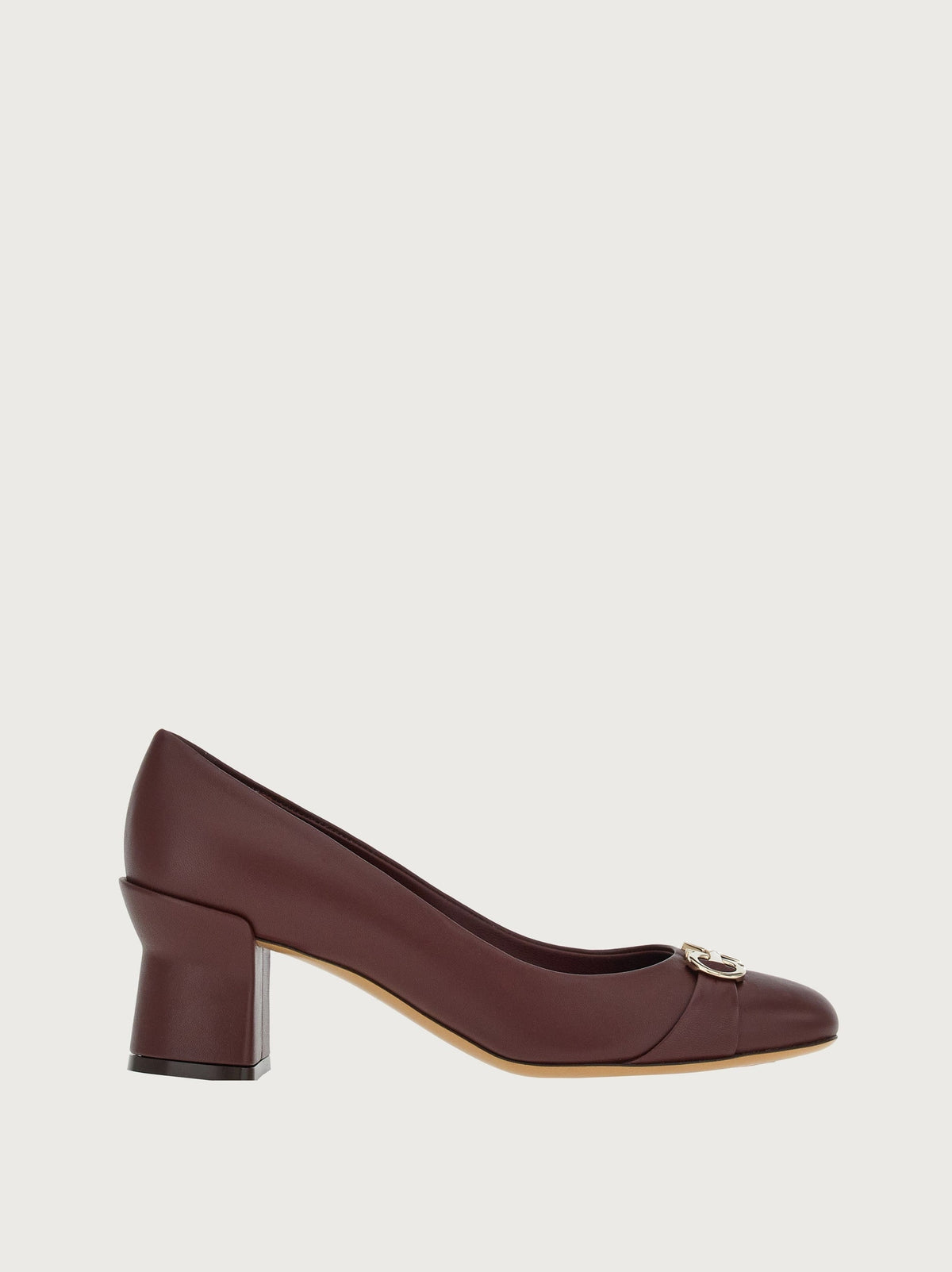 Bordeaux leather pump with gold-tone Gancini hardware, side view by Salvatore Ferragamo
