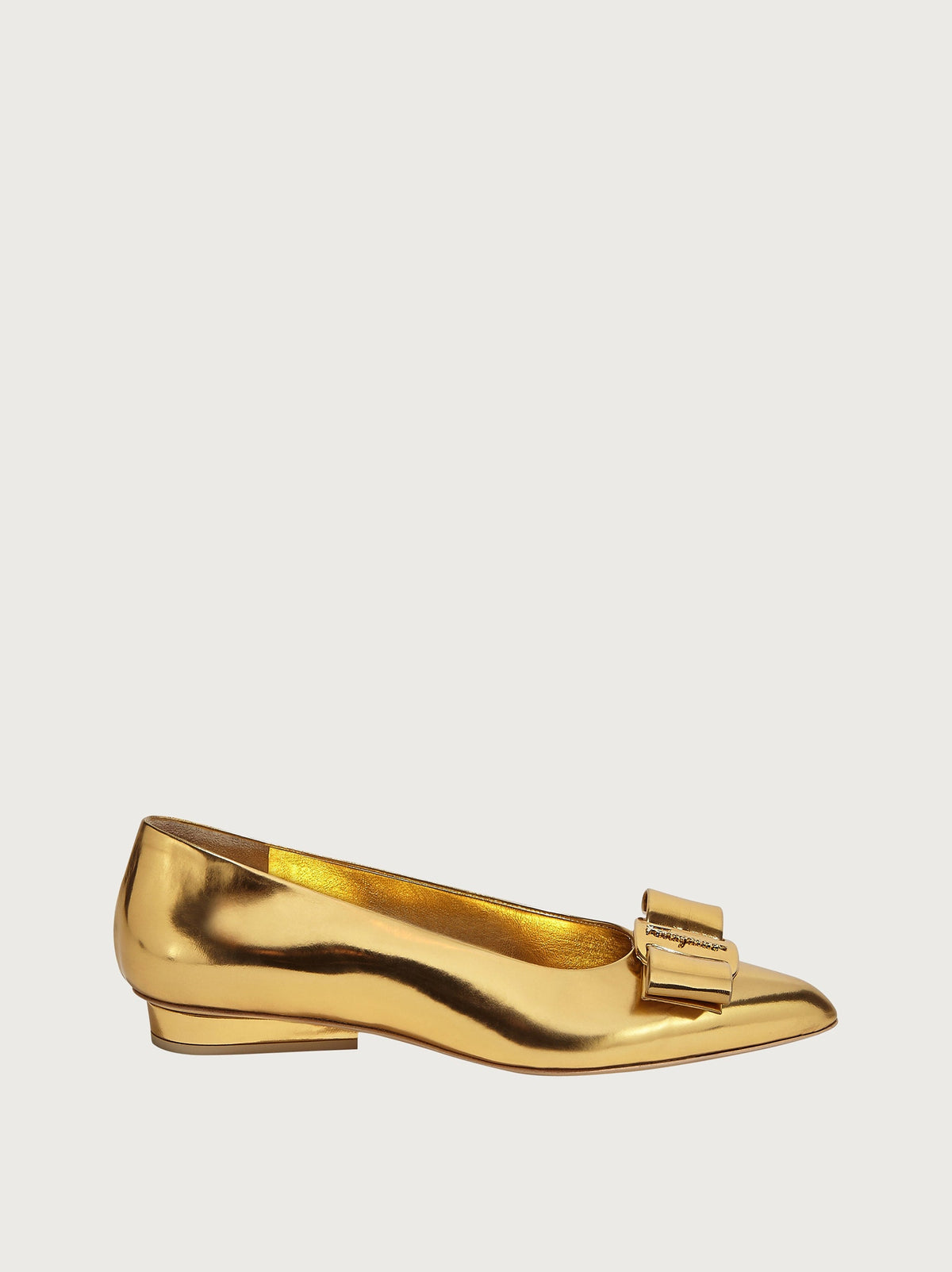 Gold leather Salvatore Ferragamo pointed-toe flat, top view showing vamp