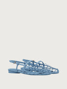 Light blue Salvatore Ferragamo flat sandal with gold-tone buckle, front view