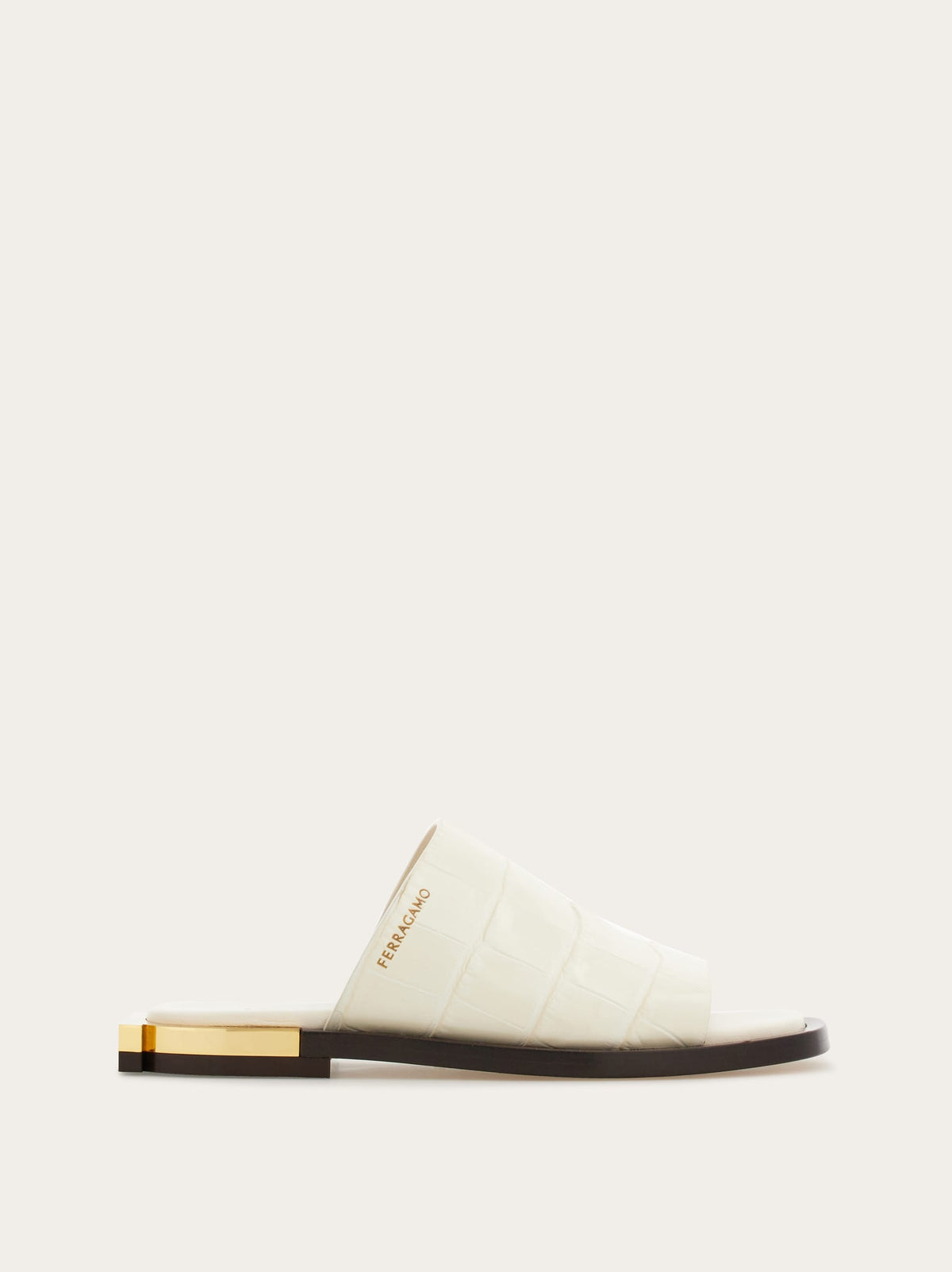 White croc-embossed leather slide sandal with gold hardware, front three-quarter view by Salvatore Ferragamo