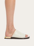 White leather slide sandal by Salvatore Ferragamo, top view showing open-toe design
