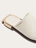 Salvatore Ferragamo white leather slide sandal, alternate angle showing textured upper