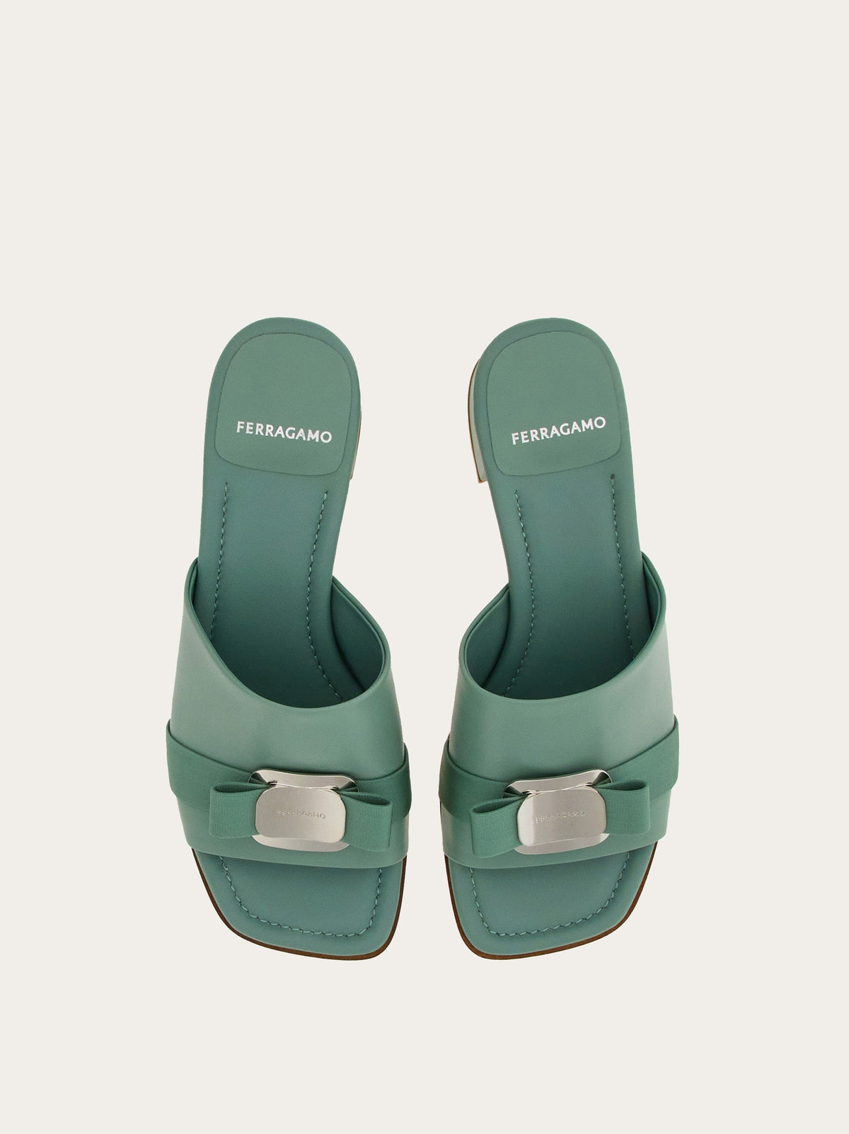 Light olive green Salvatore Ferragamo Vara Plate slides, side profile view