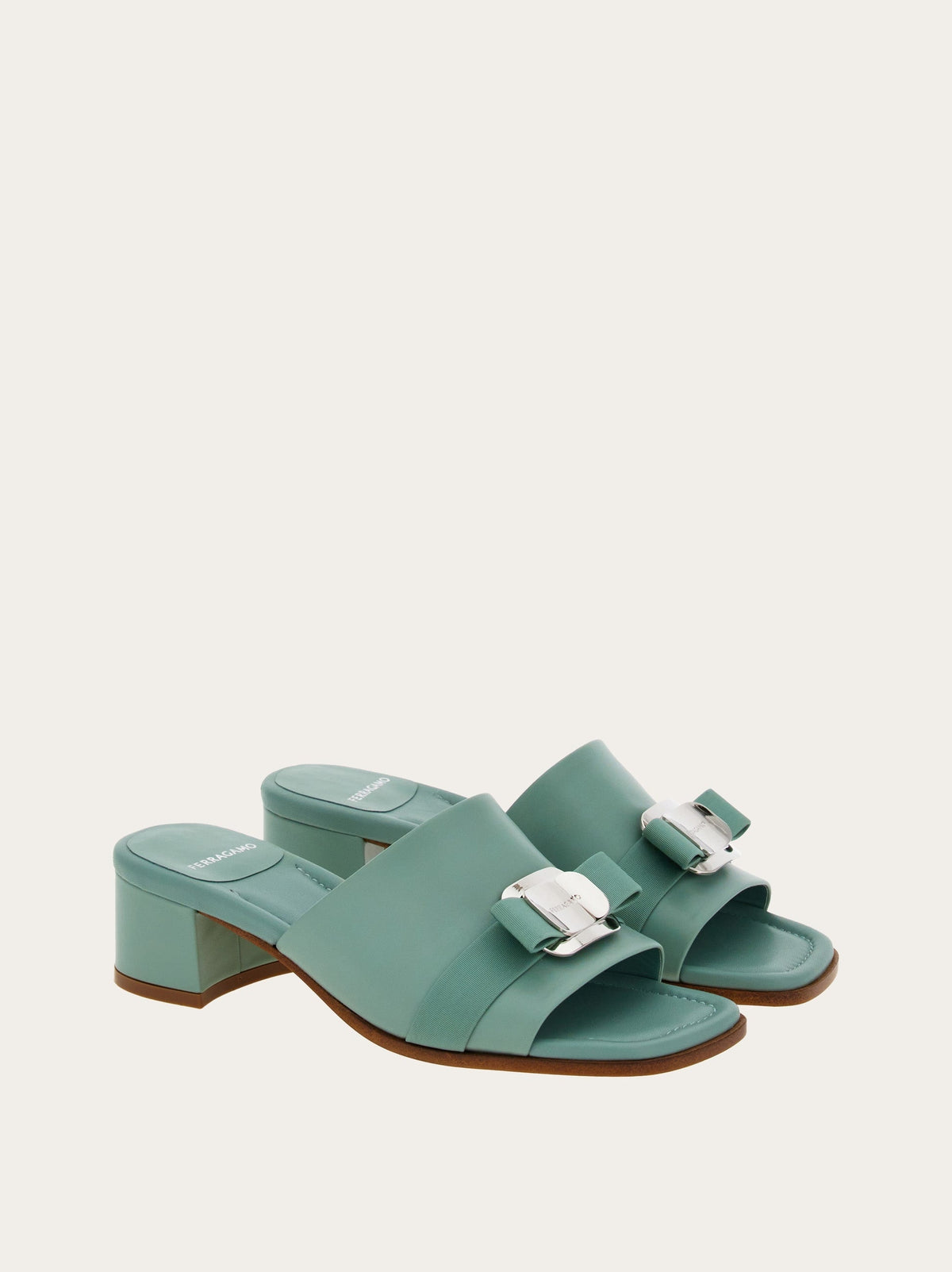 Light olive green Salvatore Ferragamo Vara Plate slides, insole detail with branding