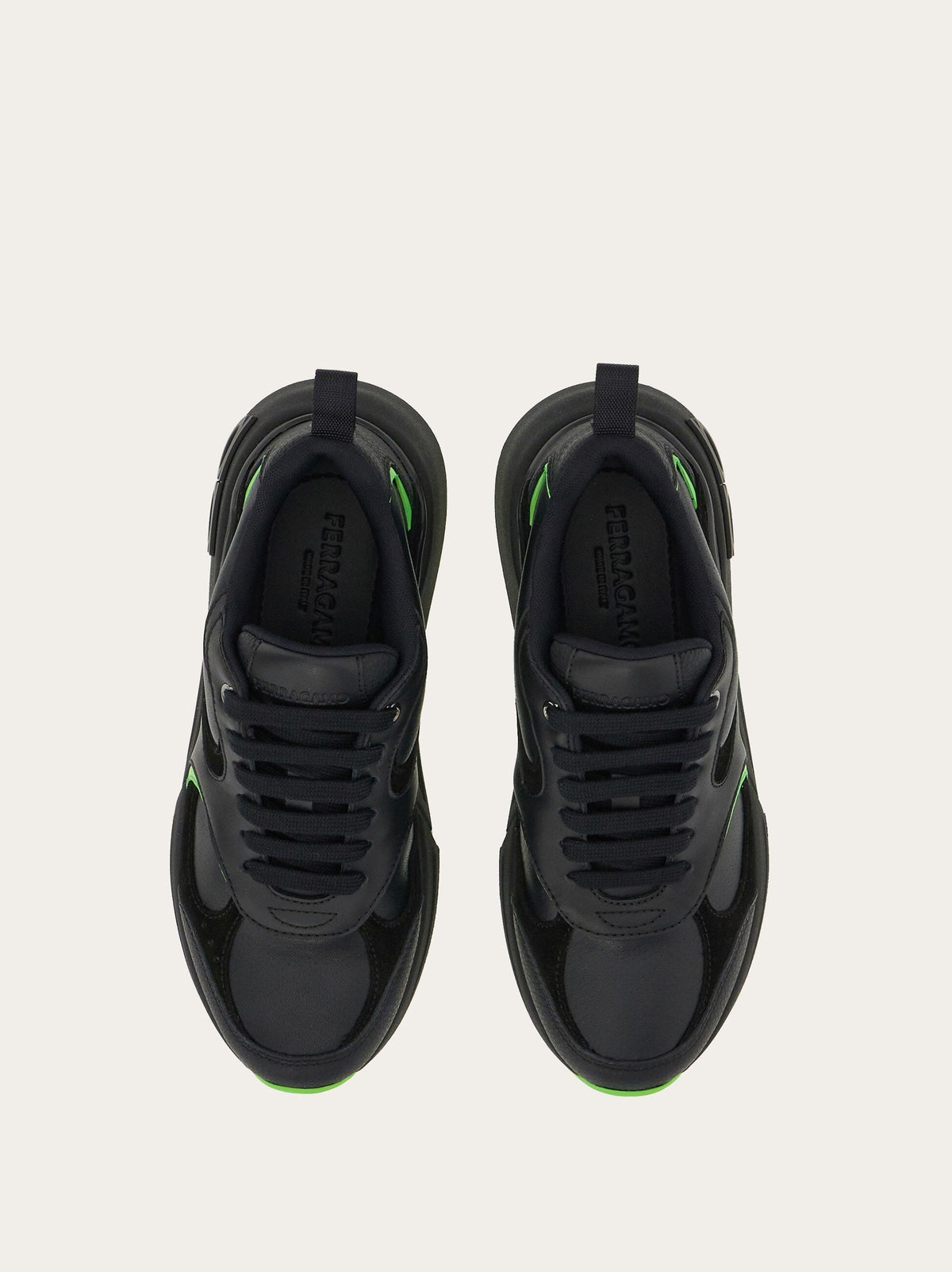 Black Salvatore Ferragamo Cosimina sneaker showing Gancini plaque detail