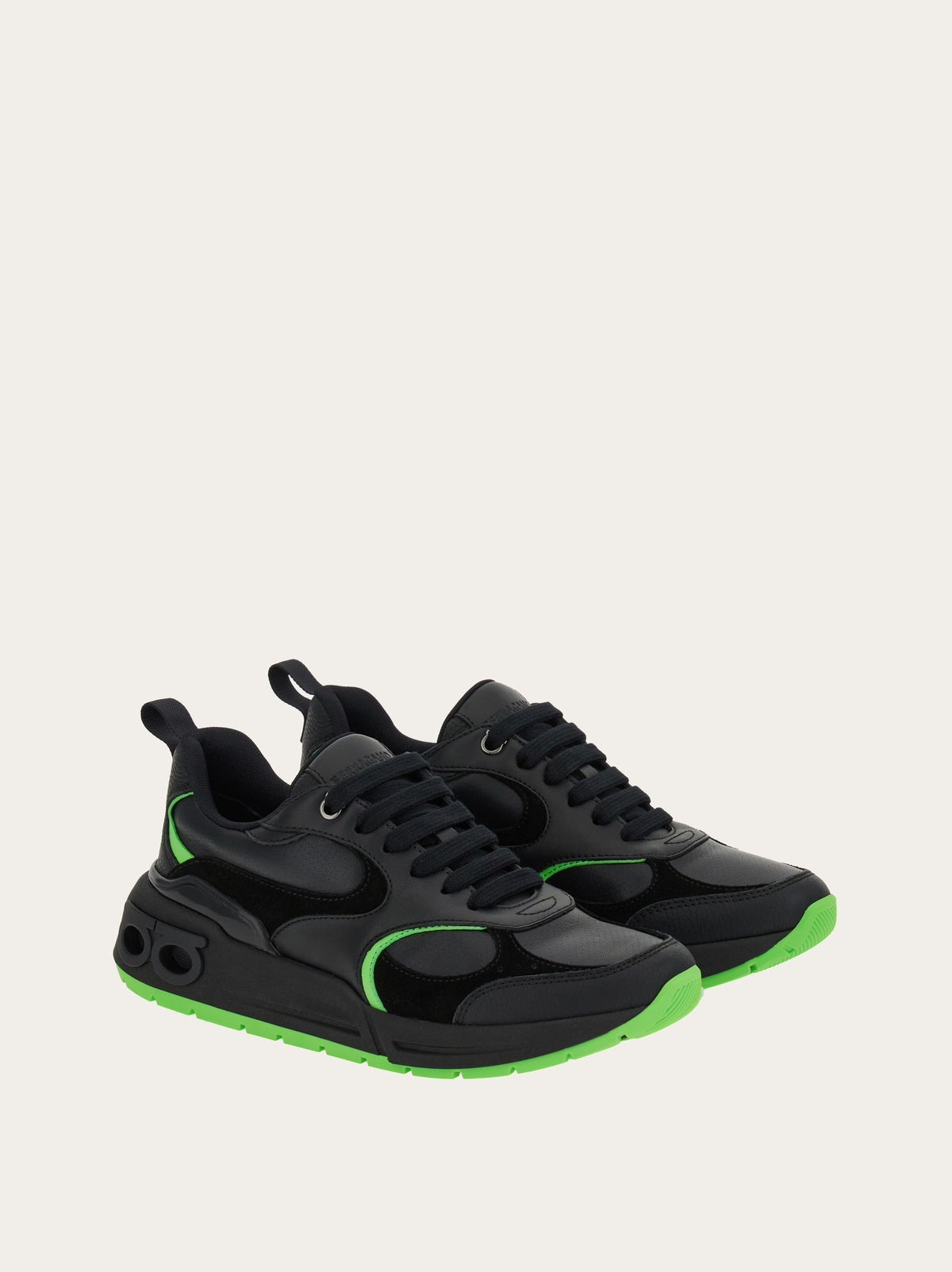 Black Salvatore Ferragamo Cosimina sneaker showing ridged rubber sole