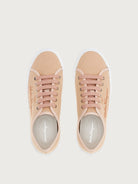 Light pink Salvatore Ferragamo sneaker with gold-tone eyelets, front angle