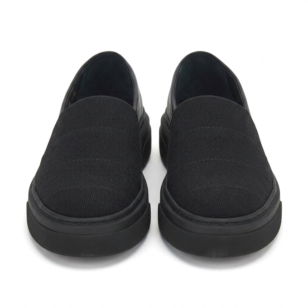 Black canvas Cassiopea slip-on sneaker with strap closure by Salvatore Ferragamo, side view
