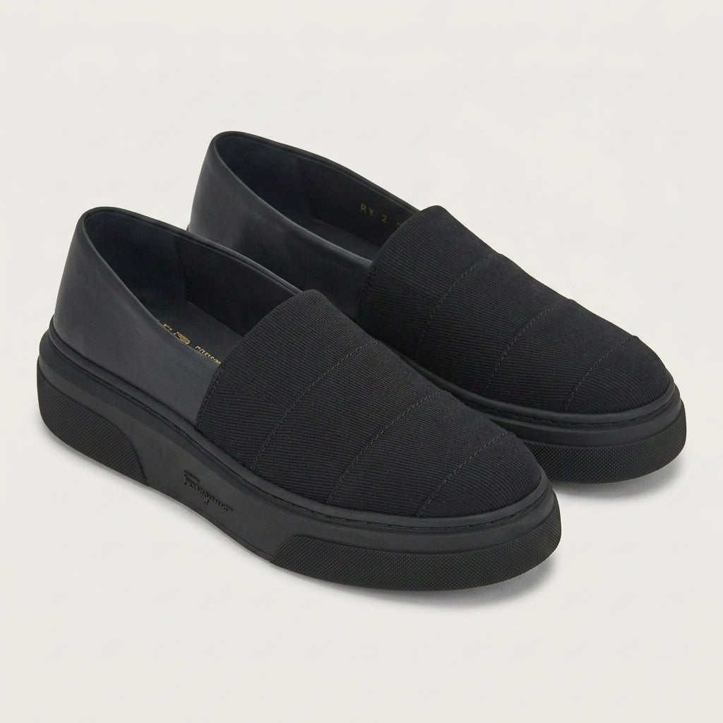 Black Salvatore Ferragamo Cassiopea sneaker with chunky rubber sole, front angle