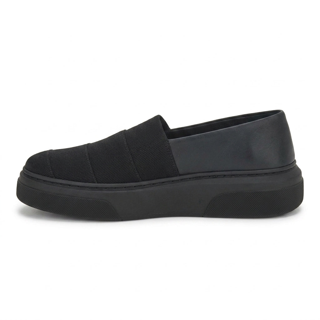 Salvatore Ferragamo black canvas slip-on sneaker showing wide strap detail, top view