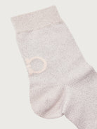Light blush pink Salvatore Ferragamo crew sock showing underfoot signature