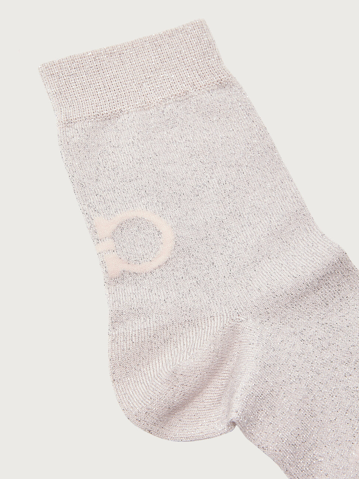 Light blush pink Salvatore Ferragamo crew sock showing underfoot signature