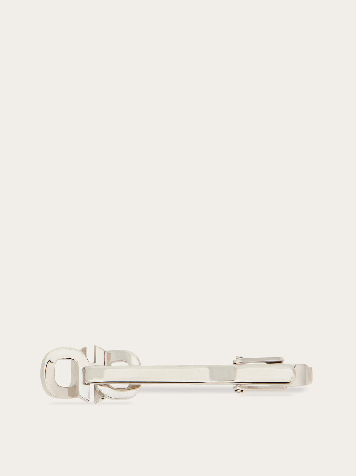 Close-up of cut-out logo detail on Ferragamo silver-tone tiepin