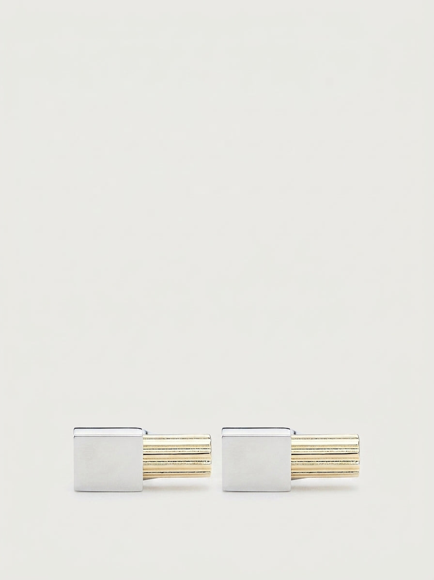 Silver and gold-tone metal cufflinks with ridged bar design by Salvatore Ferragamo, front view