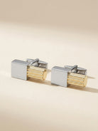 Salvatore Ferragamo two-tone cufflinks showing textured bar detail, angled view