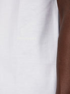 Salvatore Ferragamo tonal logo detail at front hem, close-up