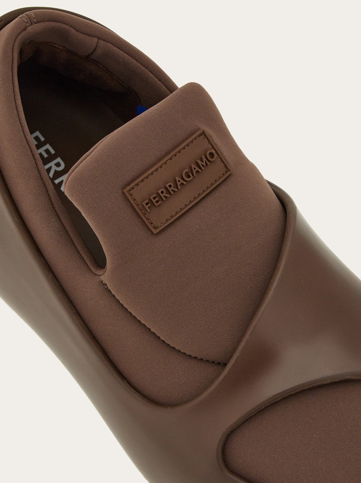 Medium brown Salvatore Ferragamo hybrid slip-ons showing sole construction, bottom view