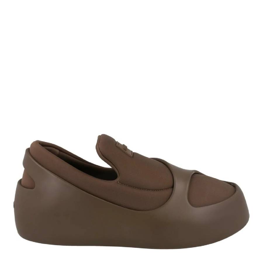 Medium brown Salvatore Ferragamo slip-on sneakers with rubberized tag detail, close-up