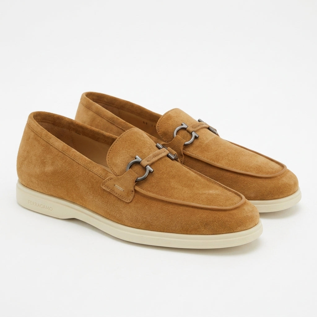 Salvatore Ferragamo brown suede slip-on showing vamp ornament detail, front angle
