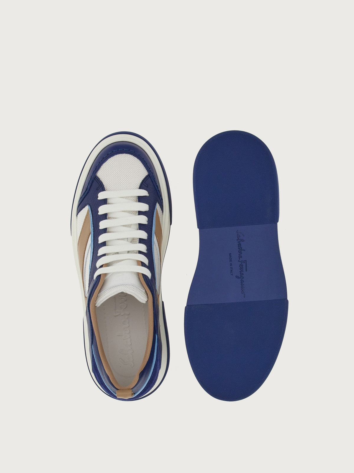 Navy blue Salvatore Ferragamo Cassina sneakers showing debossed logo patch detail