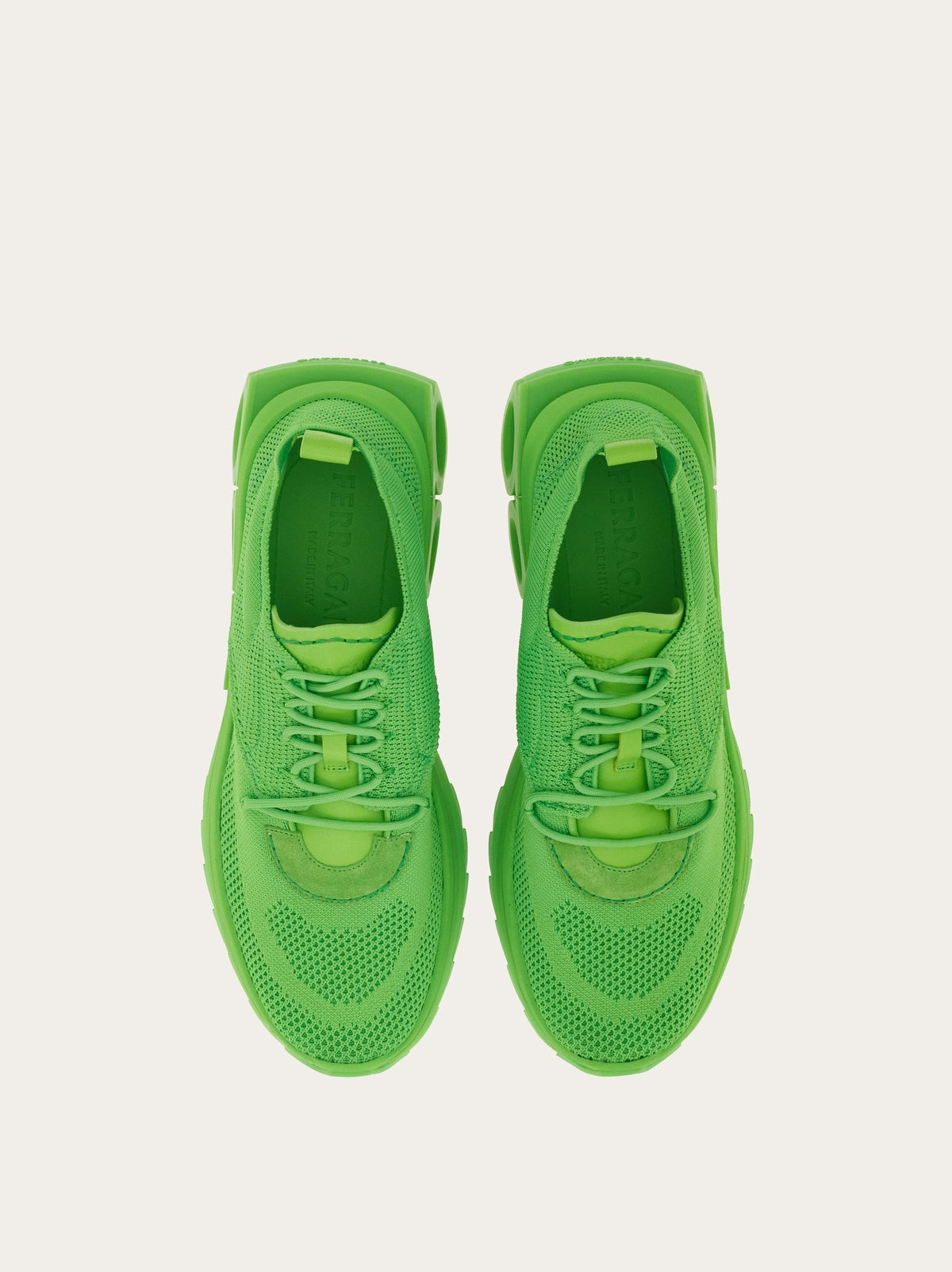 Neon lime green Salvatore Ferragamo Nima sneakers with suede detailing, angled view