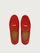 Red suede Salvatore Ferragamo penny driver, top view showing saddle