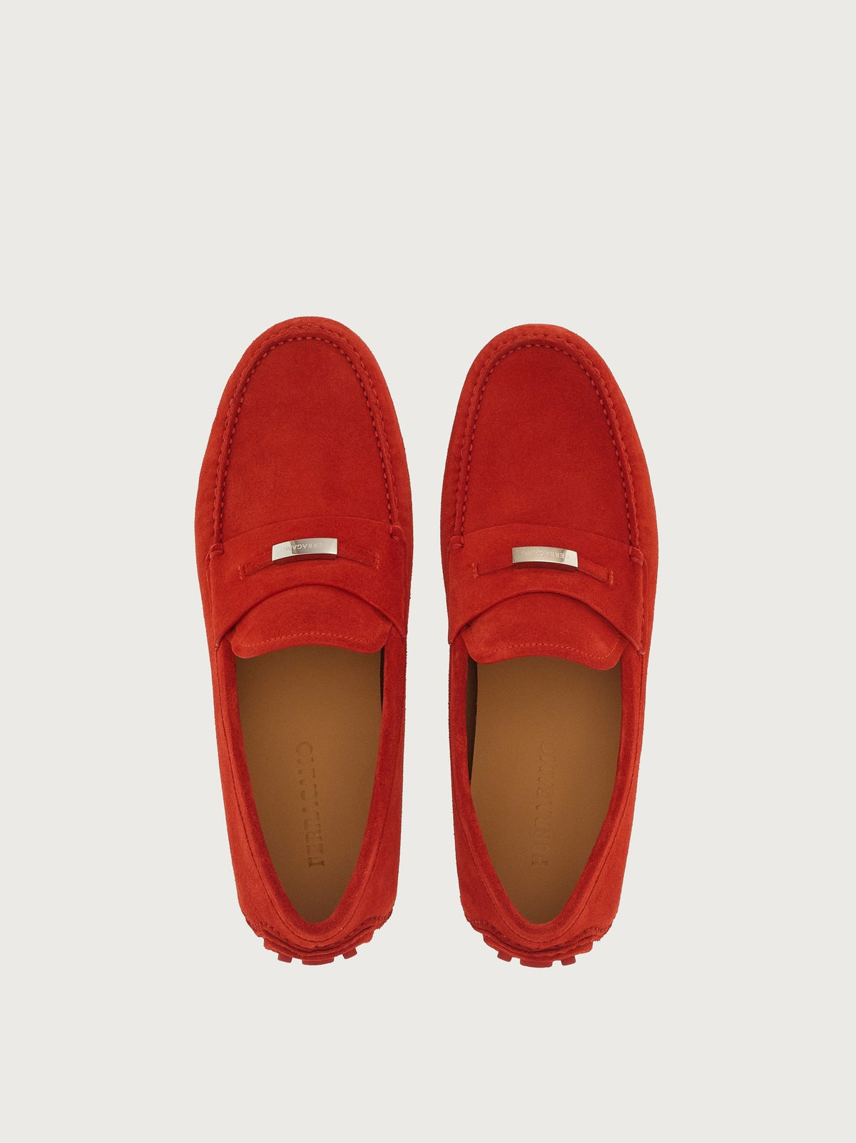 Red suede Salvatore Ferragamo penny driver, top view showing saddle