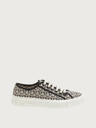 Beige Ferragamo Anson sneakers showing white platform sole, angled view