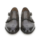 Dark grey Salvatore Ferragamo double monk strap shoe with perforated cap toe, side view