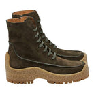 Dark brilliant green suede boot by Salvatore Ferragamo, sole detail with tan rubber lug