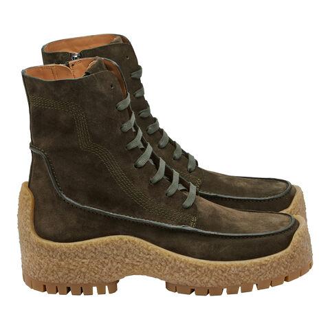Dark brilliant green suede boot by Salvatore Ferragamo, sole detail with tan rubber lug