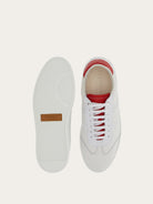 Salvatore Ferragamo white leather sneaker showing rubber sole detail, bottom view