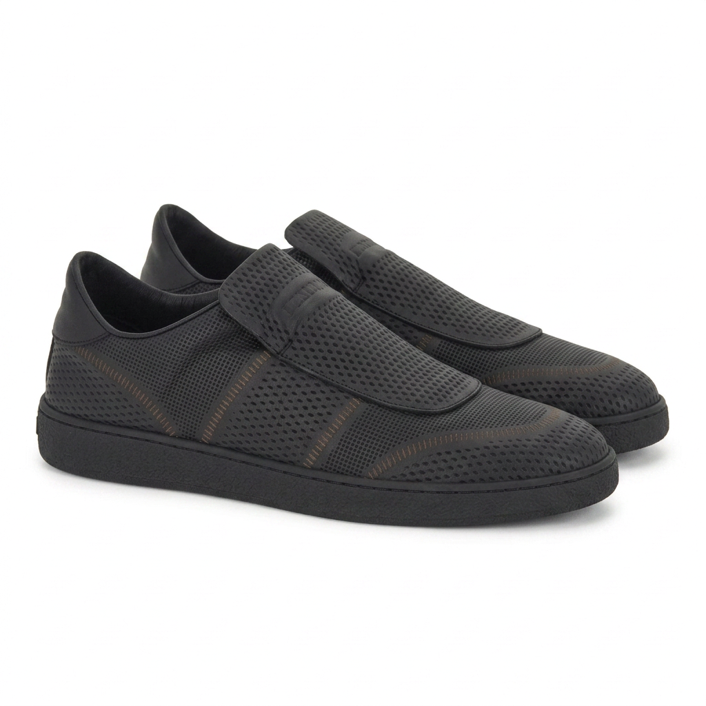 Black Salvatore Ferragamo Cibreo sneaker with perforated leather upper, front angle view
