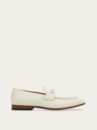 Off-white leather moccasin with silver-tone bit ornament by Salvatore Ferragamo, side view
